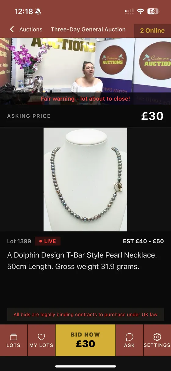 A live sale in the app, with video, the asking price and a bid button